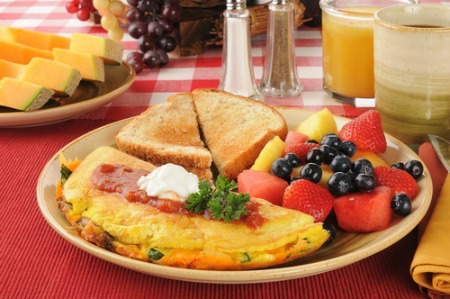 Plate with western omelet, mixed fruit, and toast